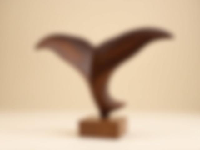 Carved Wooden Whale Tail sculpture on a wooden stand